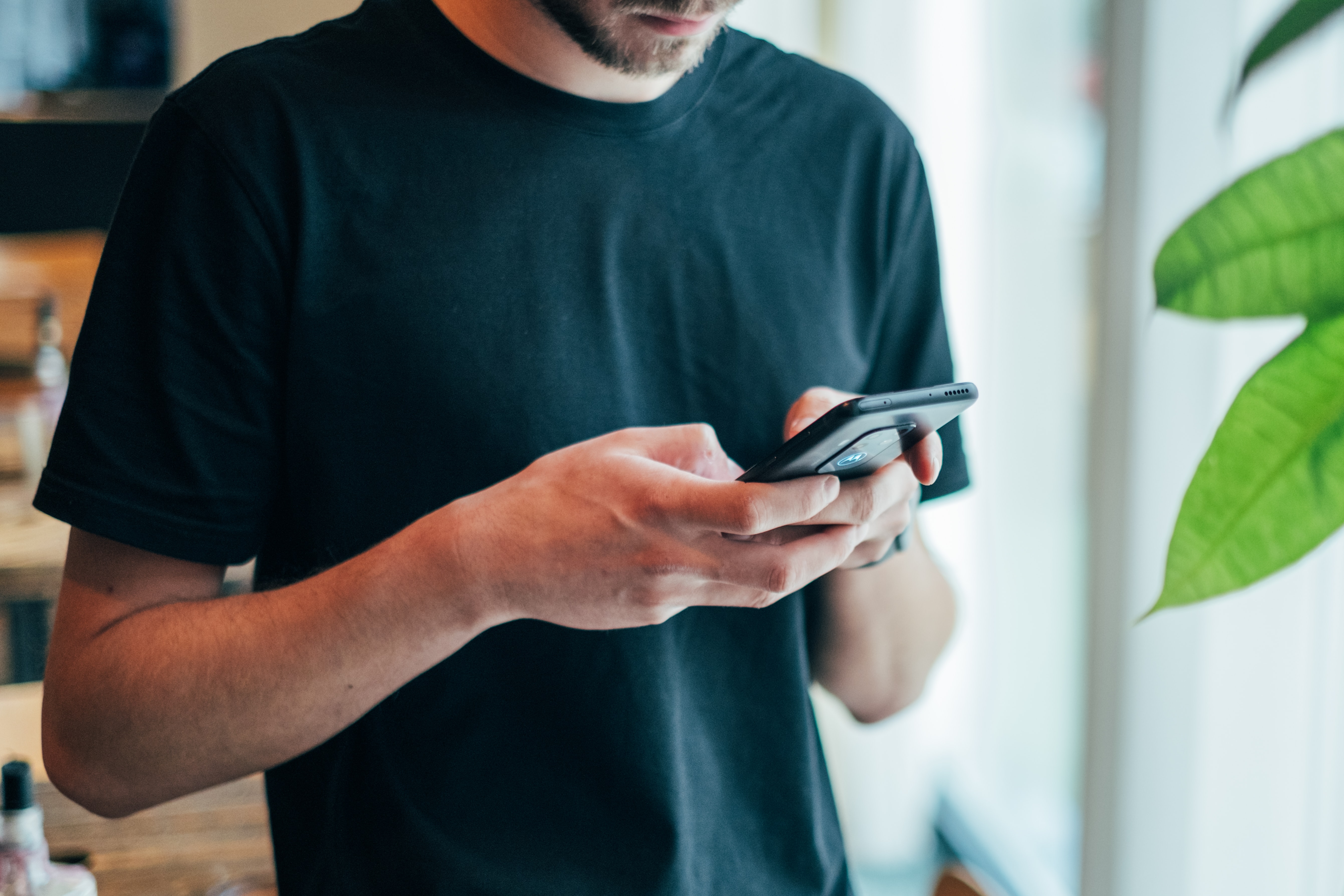 Man using phone for mobile banking