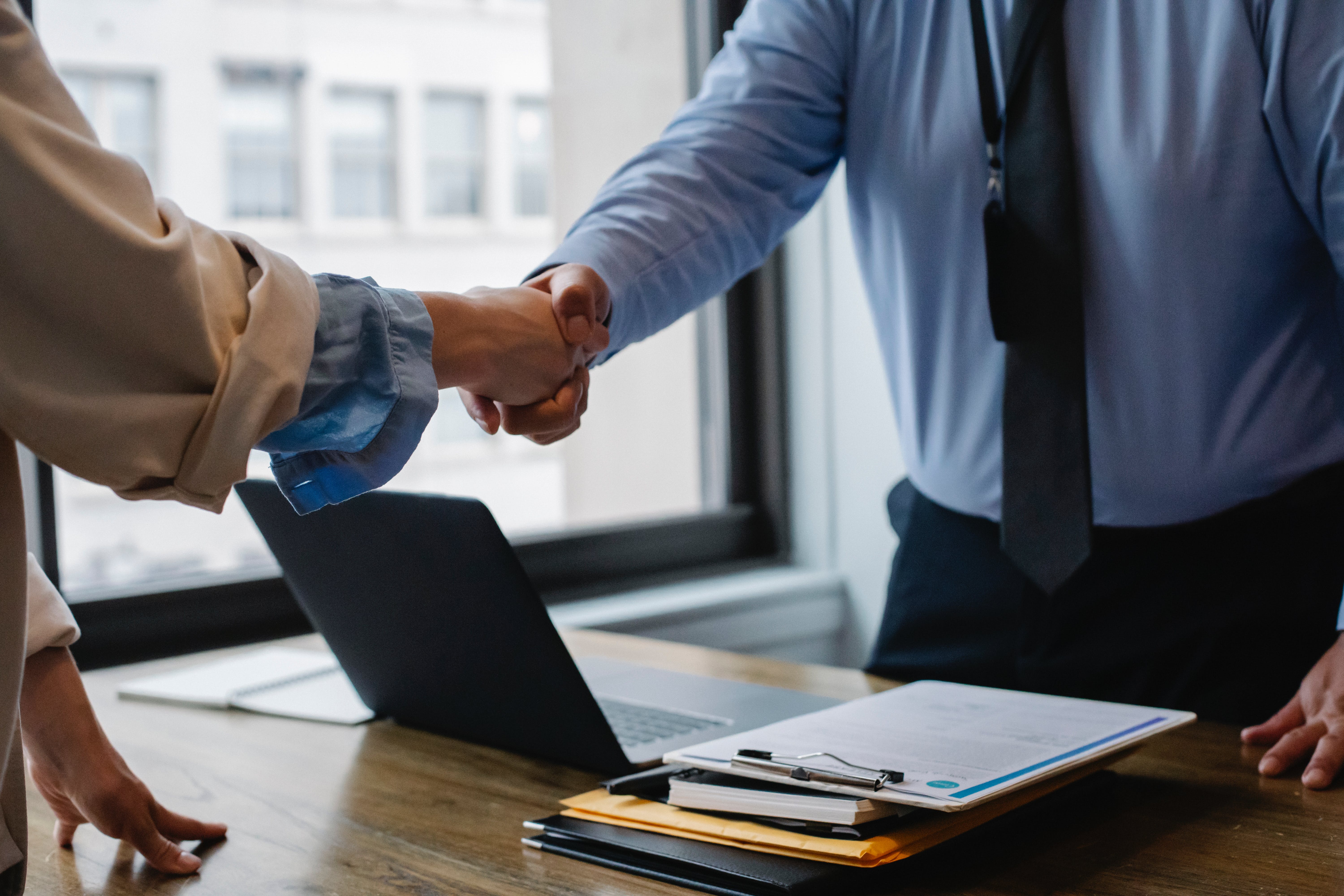 Banker shaking hands with a customer