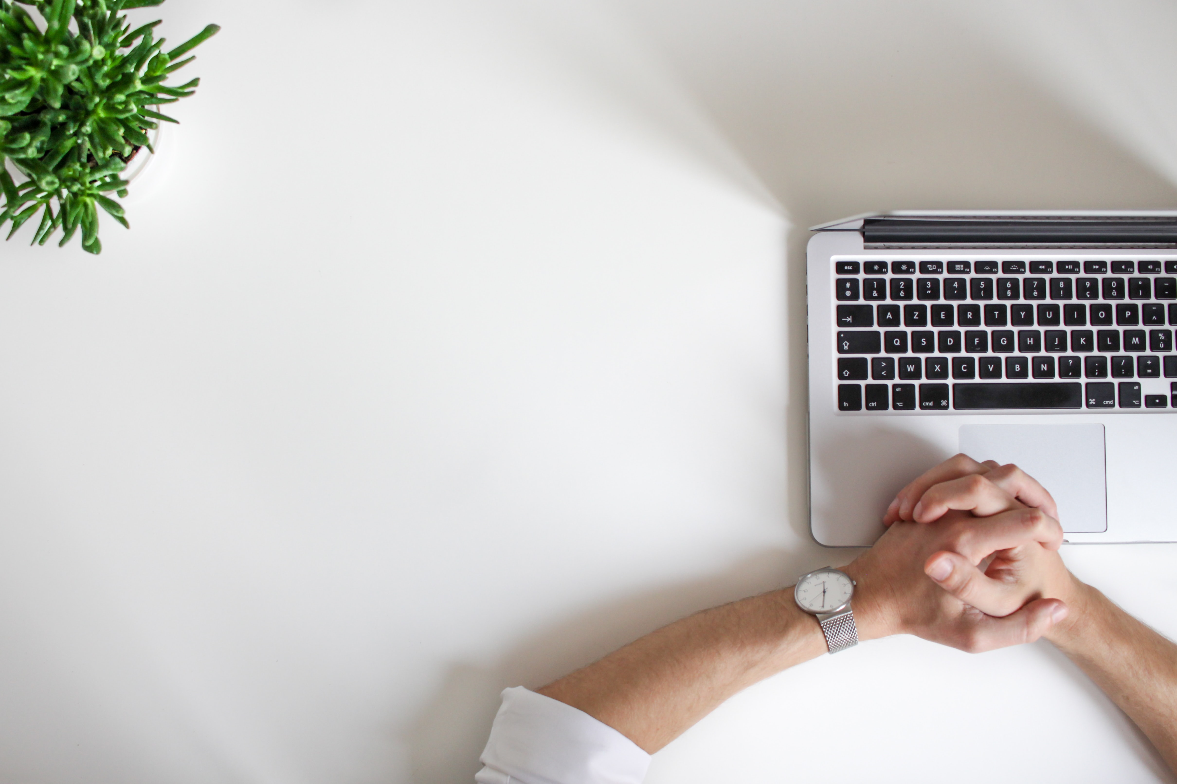 Man patiently sitting in front of laptop