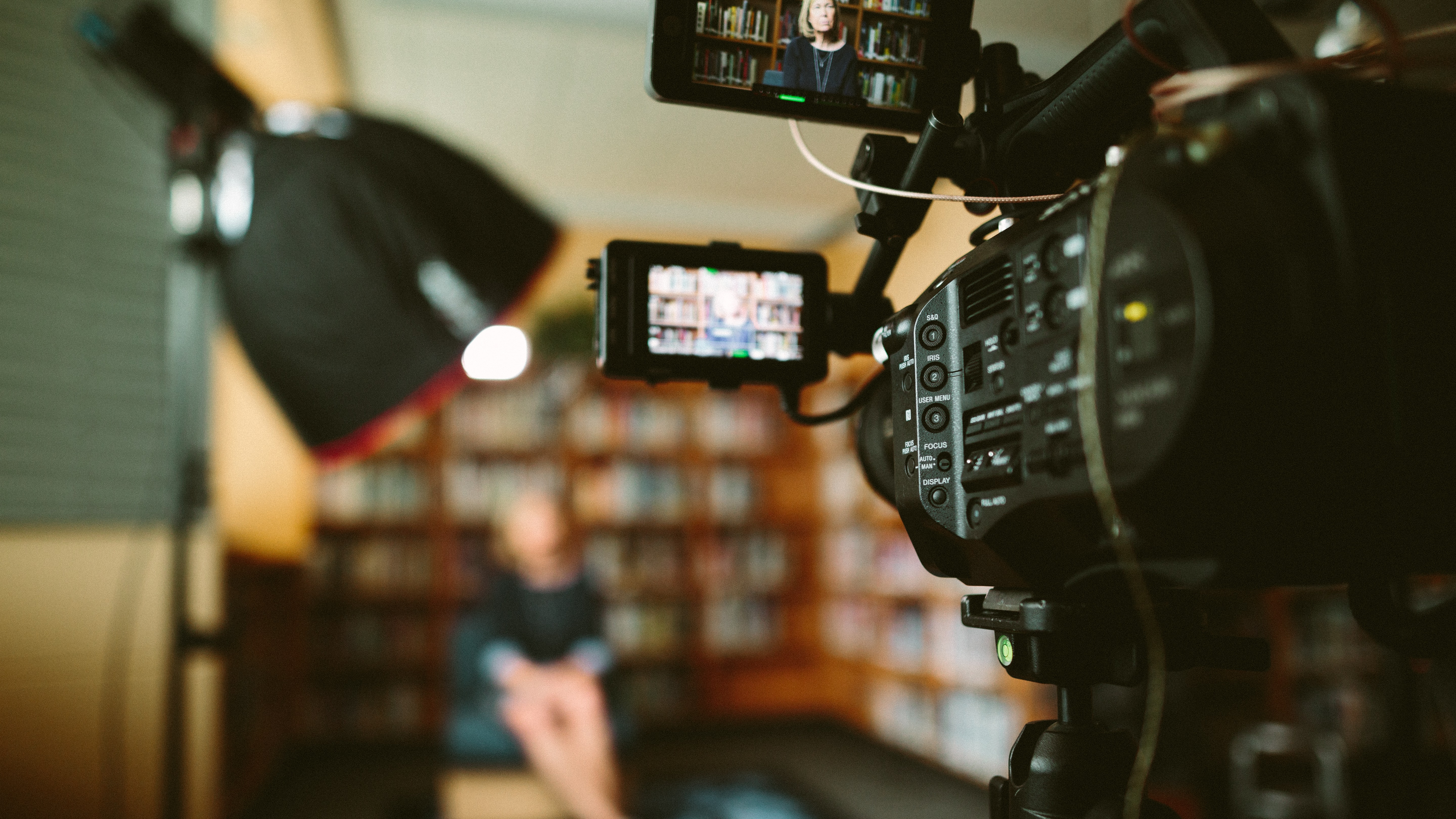 camera filming an interview